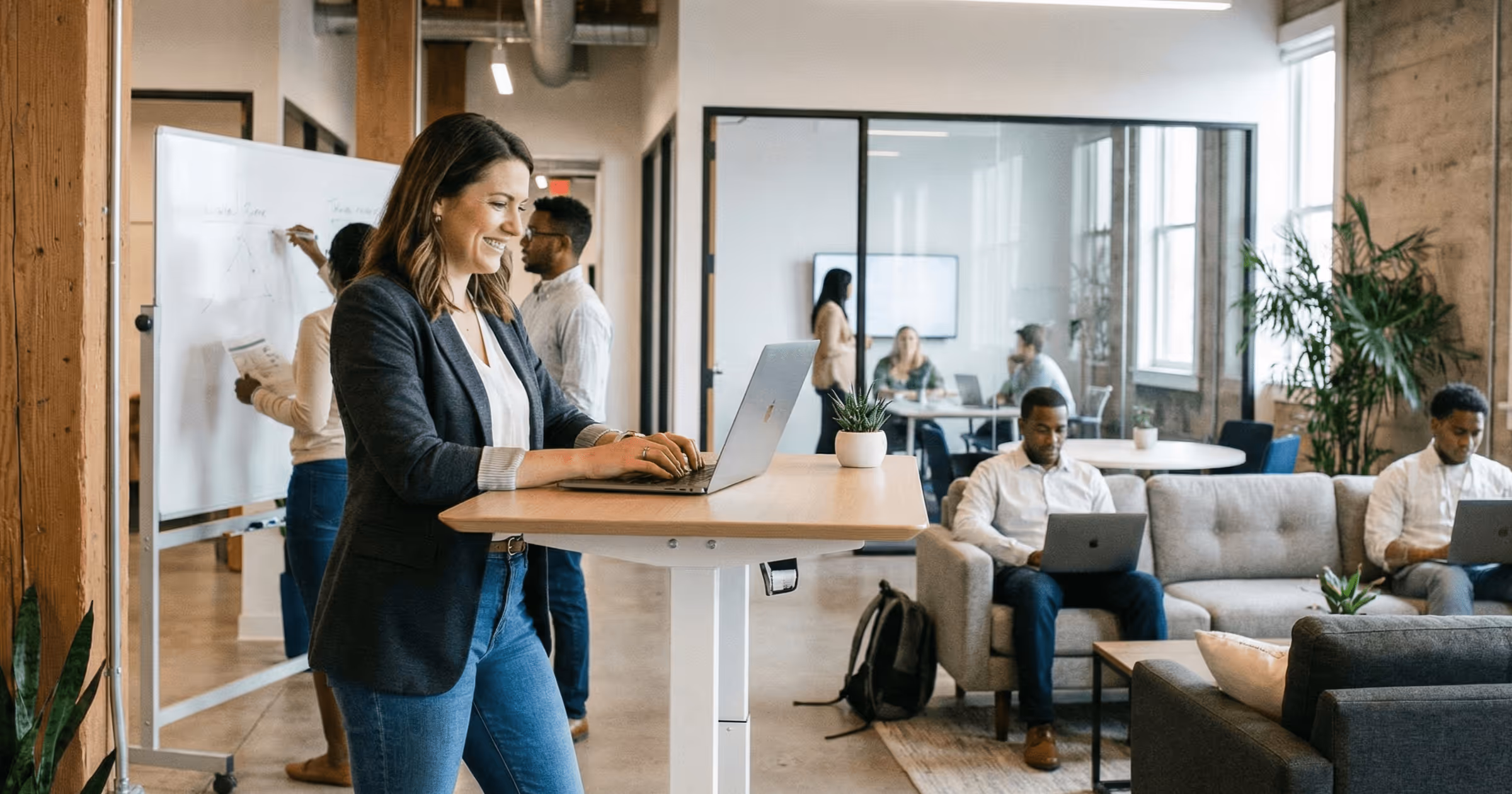 Employee standing at desk.
